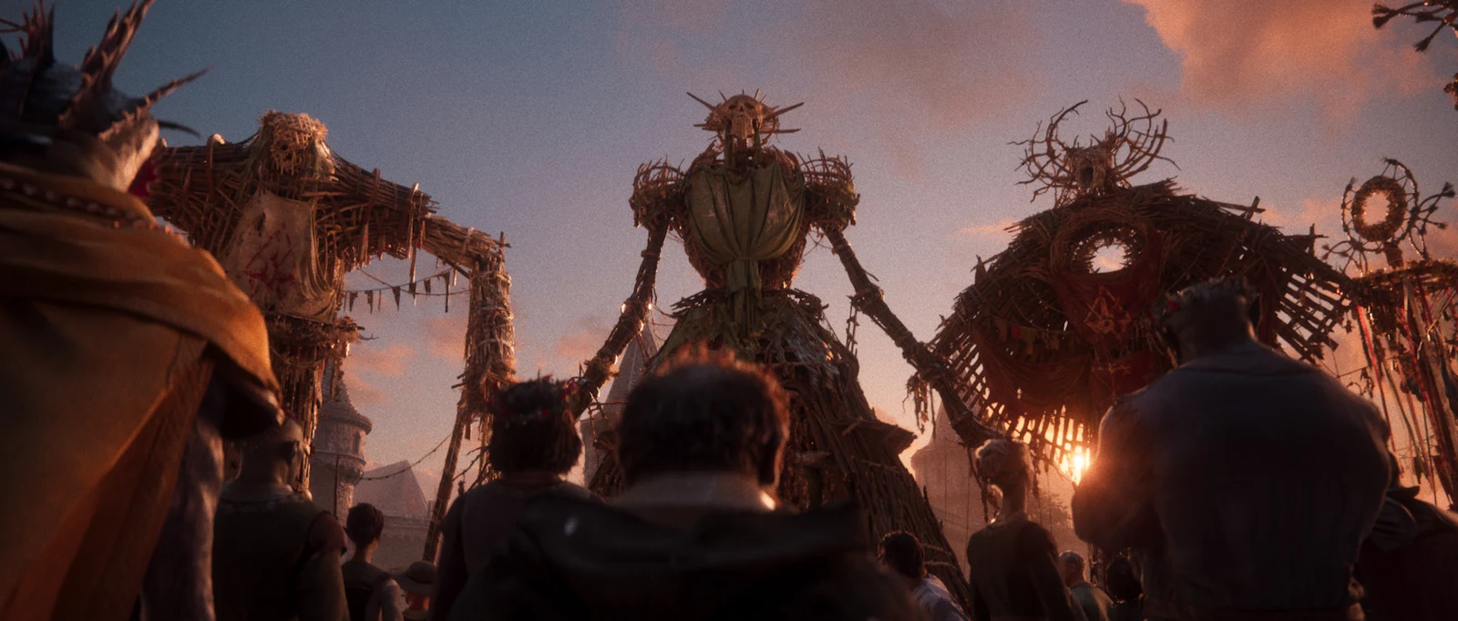 Festival guests and large figures in the official Divinity cinematic.